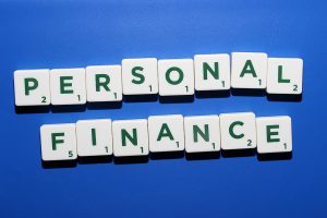 Personal finance spelled out in dark green and white scrabble letters
